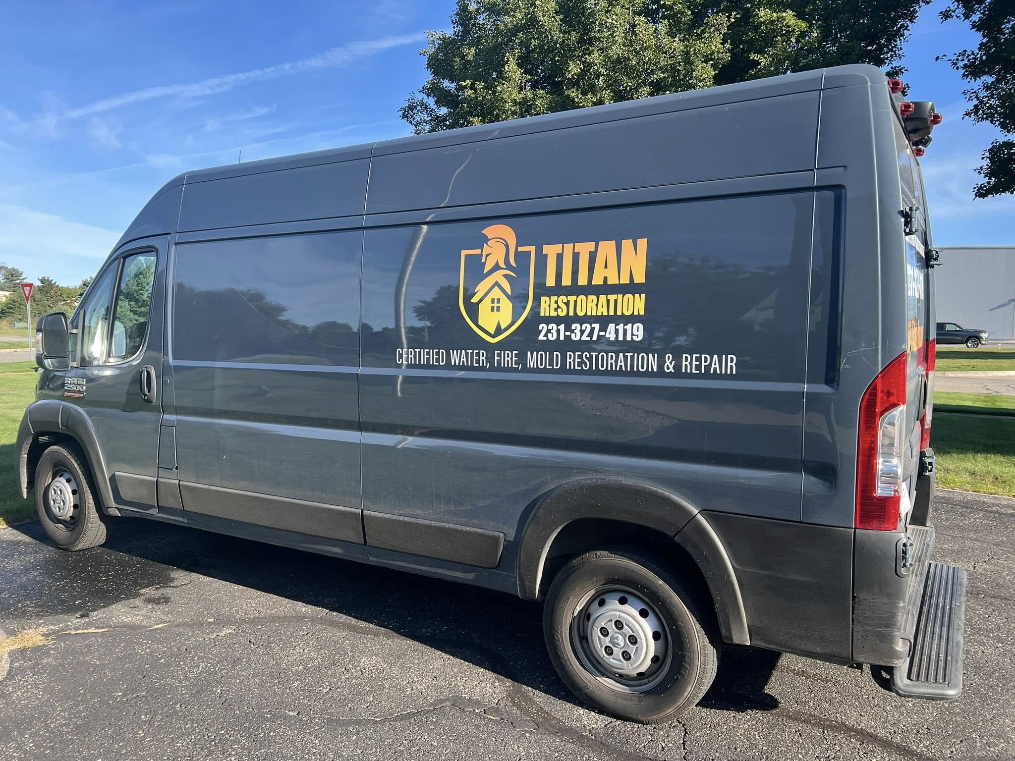 Titan Restoration response van marked with certified water, fire and mold restoration and repair